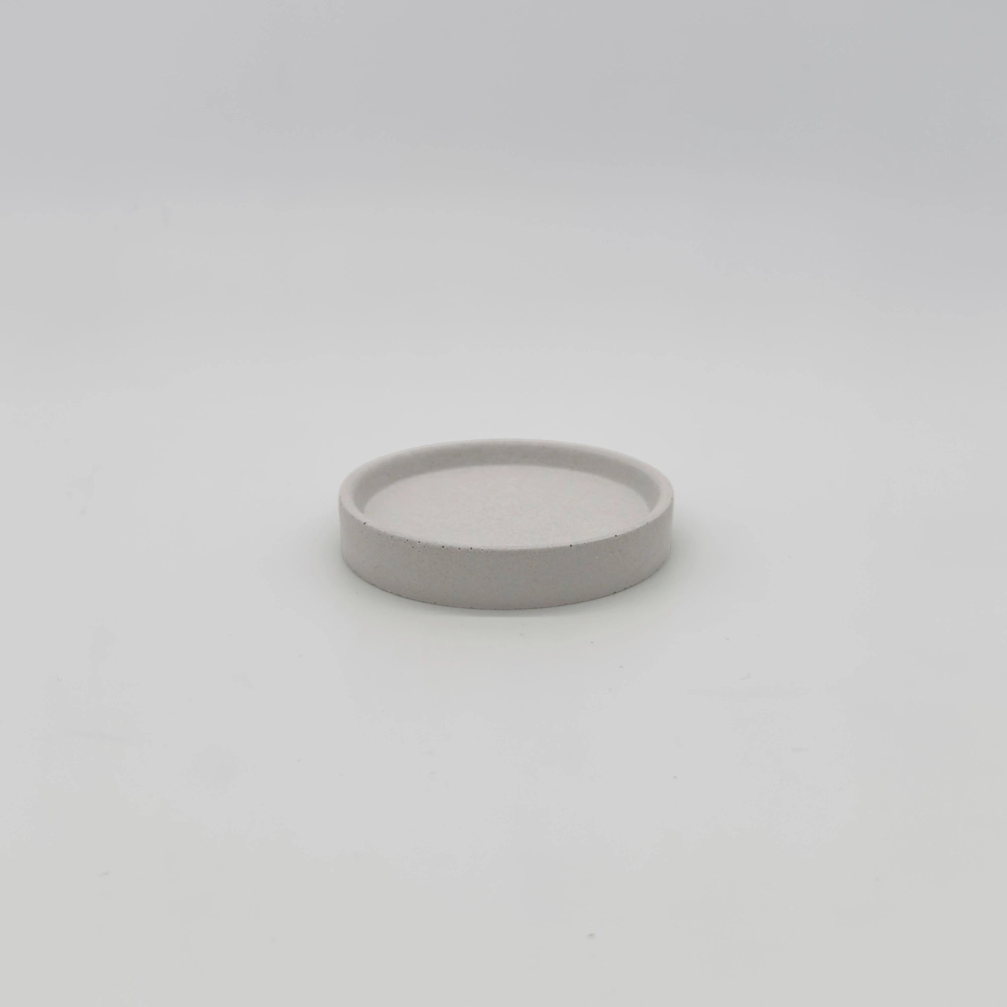 Rounder Podtácek s hranou z UHPC betonu kulatý 10cm